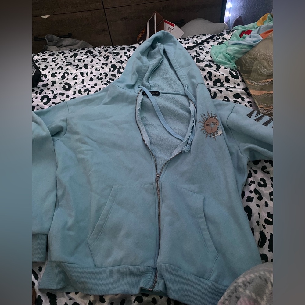 Light Blue Hoodie with Sun Design